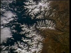 View of Earth from space, over Himalayas, mountains and lakes, STS-55 Stock Footage