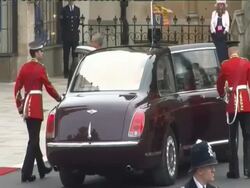 Her Majesty Queen Elizabeth II (anamorphic) at the Royal Wedding Procession: The Mall (North End) at London England. (Footage by WireImage Video/GettyImages) Stock Footage