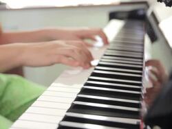 Close-up of girl playing the piano,Dolly shot Stock Footage