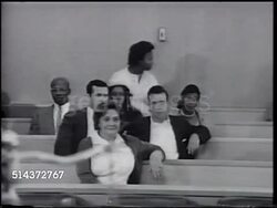 1966: JOHN SWAINSON: VS John dressed in judge's robes walking into courtroom, sitting on bench. VS People sitting in courtroom, woman testifying. CU stenotype machine w/ female court reporter fingers using keys. [VO John on judging.] Instructional Video
