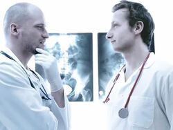 Doctor reviews x-ray Stock Footage