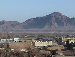 WS View of downtown with mountain in background / Musa Qala, Helmand Province, Afghanistan. Stock Footage