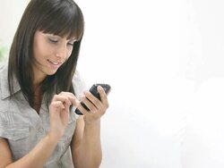 Young woman sending SMS Stock Footage