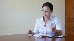 Woman working with her tablet Stock Footage