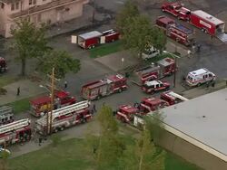 Sept. 12, 2005 aerial convoy of fire trucks leaving fire house / Hurricane Katrina / New Orleans Stock Footage