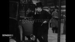 1936: THE THIRTIES: Poster 'Cabinet Meets', British Prime Minister Stanley Baldwin (1867-1947) into car. 1935: League Council meeting w/ Pierre Laval (CL) & others at round table. Prime Minister of France Pierre-Etienne Flandin talking w/ man. Instructional Video