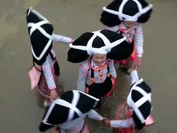 Local dancing girls in traditional chinese costumes, Long Horn Hiao, Sugao, Guizhou Province, China, Asia Stock Footage