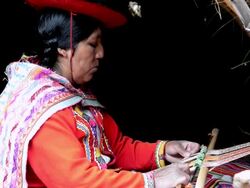 MS Local woman sitting in traditional clothes weaving yarn / Sacred Valley, Peru  Stock Footage
