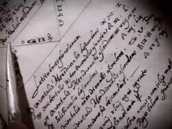 A reenactment shows a closeup of Nostradamus using a compass on a navigational chart. Stock Footage