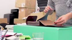 Fashion designer browsing fabric samples Stock Footage