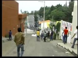 Tear gas fired as riot police try to break up protest News Clip