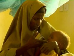 Sick child held by woman Stock Footage