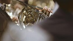 Musician playing French horn during concert Stock Footage