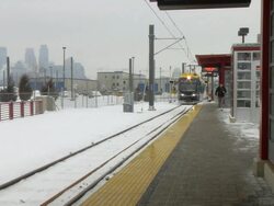 MS Light rail train pulling up to its stop at Franklin Ave / Saint Paul, Minnesota, United States Stock Footage