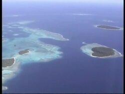 WA High angle, Tonga Islands in blue water Stock Footage