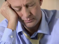 Depressed man with glass of whisky Stock Footage