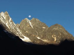 Vertical shot of Time-lapse of the moon going behind Himalayan peaks in the morning. Stock Footage