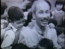 1956 B/W MS Ho Chi Minh being embraced by adoring children as he comes out of building / North Vietnam Stock Footage