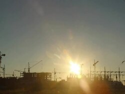 silhouettes of construction cranes at sunset (time lapse) Stock Footage
