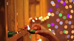 Young woman celebrating diwali, Delhi, India Stock Footage