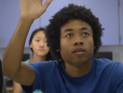 Confident Male Student Interacts in Classroom Setting Stock Footage