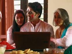 Family celebrating holi festival on the laptop Stock Footage