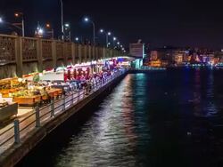 Restaurants below Galata Bridge at night Stock Footage
