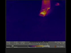 Thermographic imaging, CU feet walking into frame to camera, leaving thermal footprints Stock Footage