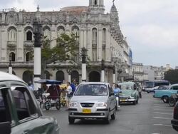 Traffic with old cars in front of Capitol building Havana Cuba Stock Footage