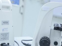 HD : Scientist Couple using microscope Stock Footage