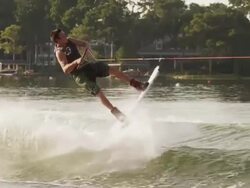 USA, Florida, Orlando, Maitland Lake, Young man doing trick on wakeboard Stock Footage