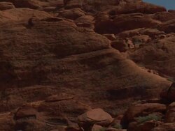 Red rock climber zoom out Stock Footage