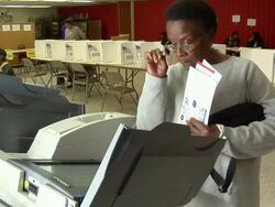 MS, Woman casting her vote at electronic voting machine, Toledo, Ohio, USA Stock Footage