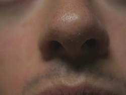 HD: Closeup of man's nose Stock Footage