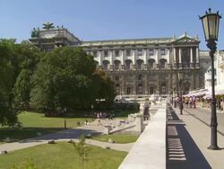 PAN Vienna Hofburg Palace and Palmenhaus (Palm House) in the Burggarten Stock Footage