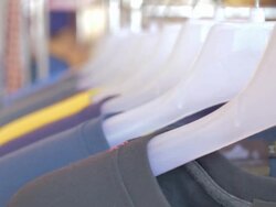 Colorful T-shirts on a coat rack,Motion focus concept Stock Footage