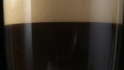 Pouring coffee. Contrasting layers Stock Footage