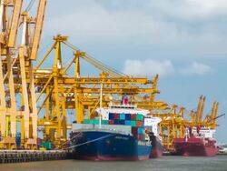 Loading cargo from truck to containership,Panning shot Stock Footage