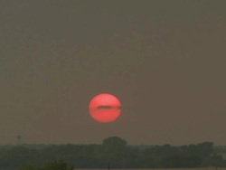 WS T/L View of orange setting sun over prairie / Hillsboro, Texas, United States Stock Footage