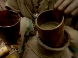 MCU Woman decanting brown water into drinking cup, Ethiopia, Africa Stock Footage