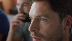 Guys sitting on couch watching tv and cheering Stock Footage