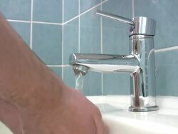 Cleaning hands under faucet Stock Footage