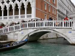MS Shot of tourist enjoying journey in gondolas at Molo Riva degli Schiavoni / Venice, Veneto, Italy Stock Footage