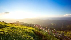 Time lapse of clouds moving over mountain at sunset Stock Footage