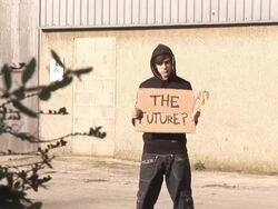 Hoody holding board saying &quot;THE FUTURE&quot; - HD &amp; PAL Stock Footage
