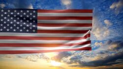 USA FLag in sunrise sky Stock Footage