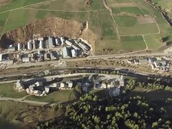 MS AERIAL Shot of village with farm field / Piedmont, France Stock Footage