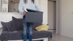 Graphic designer carrying box with drawings, working at home Stock Footage