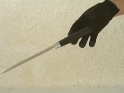 High Speed Knife slips from gloved hand, Spain. Stock Footage