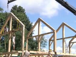 WS ZO Carpenters at working while framing an energy efficient post / Grass Lake, Michigan, USA Stock Footage